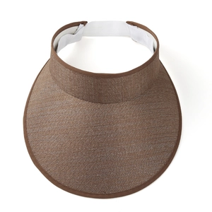 Close-up of brown woven sun visor texture and white elastic strap on sun hat