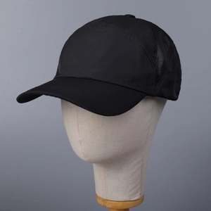 Detail view of breathable black mesh baseball cap with quick-dry fabric on model head
