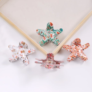 Star-shaped Christmas hair claws set with festive Santa, elk, and tree patterns