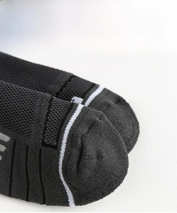 Detailed macro view of the reinforced toe design on professional athletic crew socks