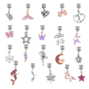 Detailed macro shot of assorted silver and rose gold charms for DIY jewelry making