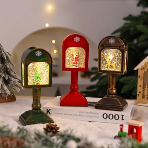 Close-up of vintage mailbox snow globe lamp featuring Santa and swirling glitter