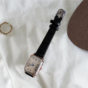 Elegant vintage square watch with rose gold case, roman numerals and black leather strap