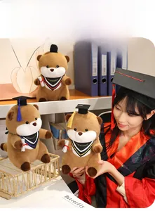 Close-up of adorable graduation otter plush with doctorate cap and graduation sash
