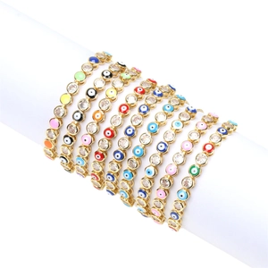 Detail of colorful enamel Evil Eye bracelets with inlaid zircons on a white display
