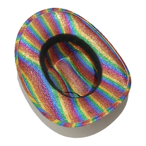 Close-up of sparkling rainbow sequin texture and stitching on a festive cowboy party hat