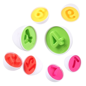 Macro detail of educational egg toy showing numbered matching slots and internal plastic parts