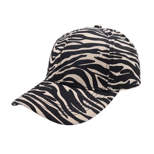Detail of zebra pattern fabric on pony-tail baseball cap with curved brim for sun protection