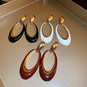 Vintage oversized oval earrings in black, white, and burgundy with golden plated finish