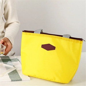 Waterproof insulated lunch bag in bright yellow with durable handles and secure zipper
