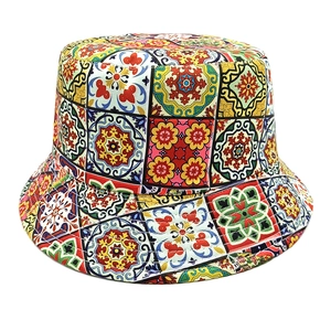 Detail of bohemian bucket hat with colorful tile patterns and reversible sun protection