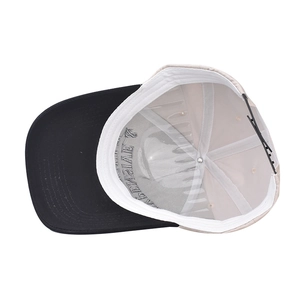 Detail of cotton baseball cap interior featuring contrast brim and adjustable strap