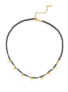 Detailed view of handmade beaded necklace with stainless steel gold discs and black stones