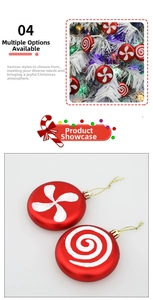 Detail of red Christmas tree ornaments with white glitter spiral and windmill patterns