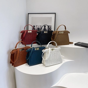 Elegant woven leather handbags with golden twist locks in six vibrant colors