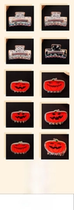 Detailed views of Halloween hair claws featuring pumpkin ghost and spider patterns