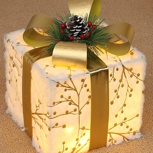 Three-piece glowing Christmas gift boxes with plush white fabric and golden ribbons