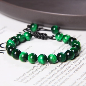 Adjustable green tiger eye beaded bracelet with black woven cord for yoga and energy
