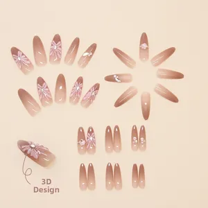 Détails de fleurs 3D et perles sur faux ongles cercueil longs avec finition dégradée