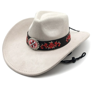 Detail of western cowboy hat featuring black leather band with red floral embroidery