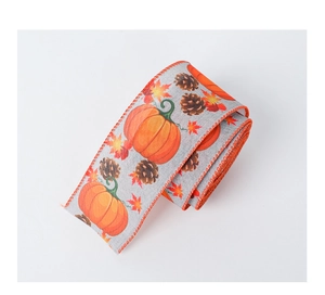 Detail of autumn ribbon with pumpkins, pine cones and maple leaves on faux linen