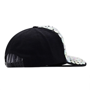 Detailed side view of black baseball cap with iridescent AB sequins and adjustable strap