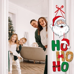 Christmas door hanger with Santa Claus and HO HO HO letters in a warm family home setting