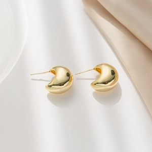 Polished gold hollow C-shape earrings for women with a minimalist crescent design