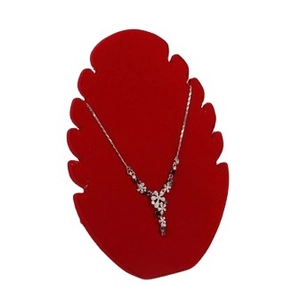 Silver flower necklace with dark gems on a red flame-shaped display stand