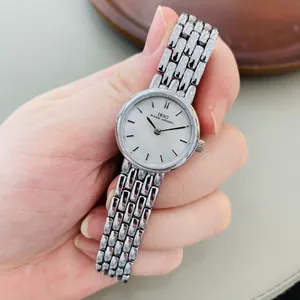 Elegant women's watch with silver steel strap and white mother-of-pearl dial