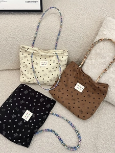Corduroy tote bags with heart prints and colorful beaded straps in three neutral colors
