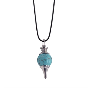 Detailed view of turquoise crystal dowsing pendulum necklace with polished silver metal cone