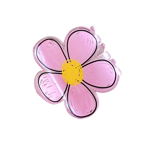 Sweet pink candy-colored flower hair claw clip with yellow center on white background