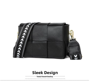 Detail view of black woven leather square bag with patterned wide strap and gold hardware