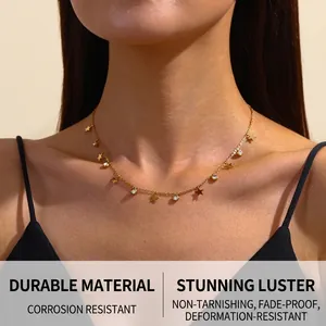 Close-up of gold stainless steel necklace featuring star charms and sparkling zircon stones