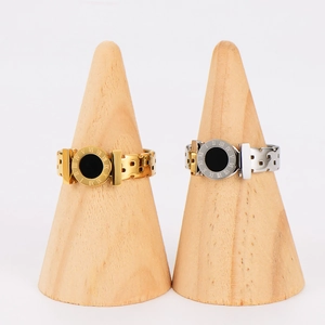Roman numeral stainless steel ring with black enamel disk in gold and silver finish