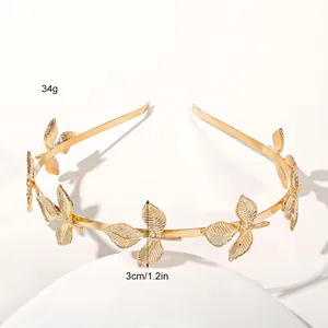 Detail view of golden leaf headband showing 3cm height and 34g weight measurements