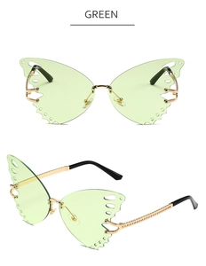Detail of green butterfly rimless sunglasses with carved edges and golden metal temples