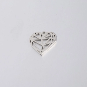 Macro view of a geometric hollow silver heart pendant with a metallic faceted design
