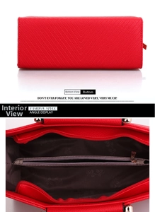 Detail of red embossed handbag showing three inner compartments and floral lining
