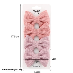 Detail showing dimensions and weight of pink fabric bow hair clips for baby girls