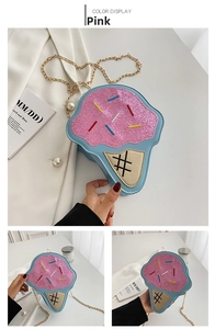 Detail of glittery blue and pink ice cream crossbody bag with golden chain strap
