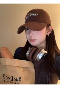 Detailed embroidery of Don't be late text on a brown vintage baseball cap