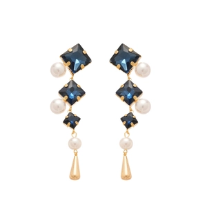 Elegant gold drop earrings with blue square crystals and white pearls on white background