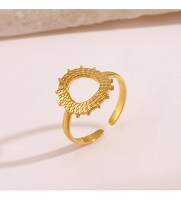 Macro detail of golden sunflower open ring featuring beaded texture and hollow sunburst design