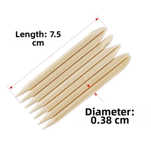 Dual-tip orange wood nail sticks showing sharp and slanted ends for cuticle care