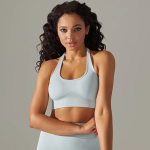 Detail of light blue seamless sports bra with vertical ribbed texture and racerback design