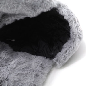 Detail of grey faux fur aviator hat with black diamond quilted lining for warmth