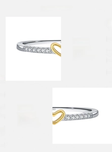 Macro detail of hand-set 5A cubic zirconia stones on S925 sterling silver heart ring