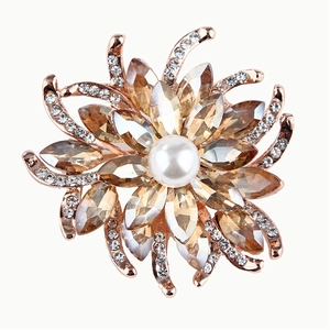 Elegant rose gold flower brooch with champagne crystals and white pearl center